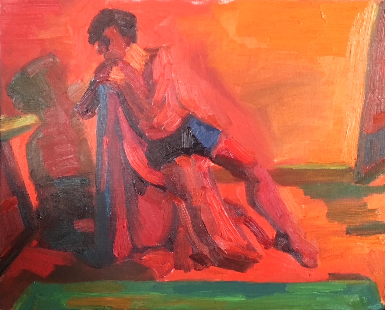 Seated male figure painting in reds and oranges