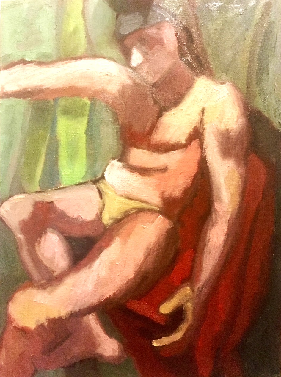 Male figure seated on red chair